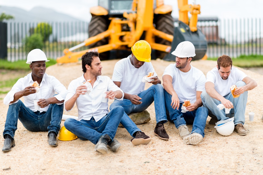 Group of construction workers on a break at a building site